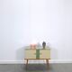 Vintage green DDR cabinet, model Libelle with glass top, slanted legs.