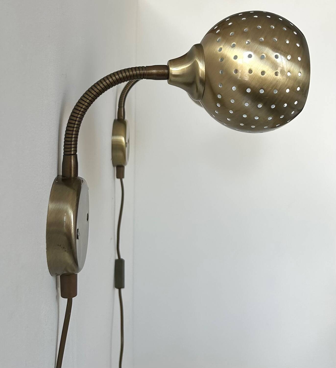 Pair of vintage adjustable wall lights, perforated brass, Sweden 1960