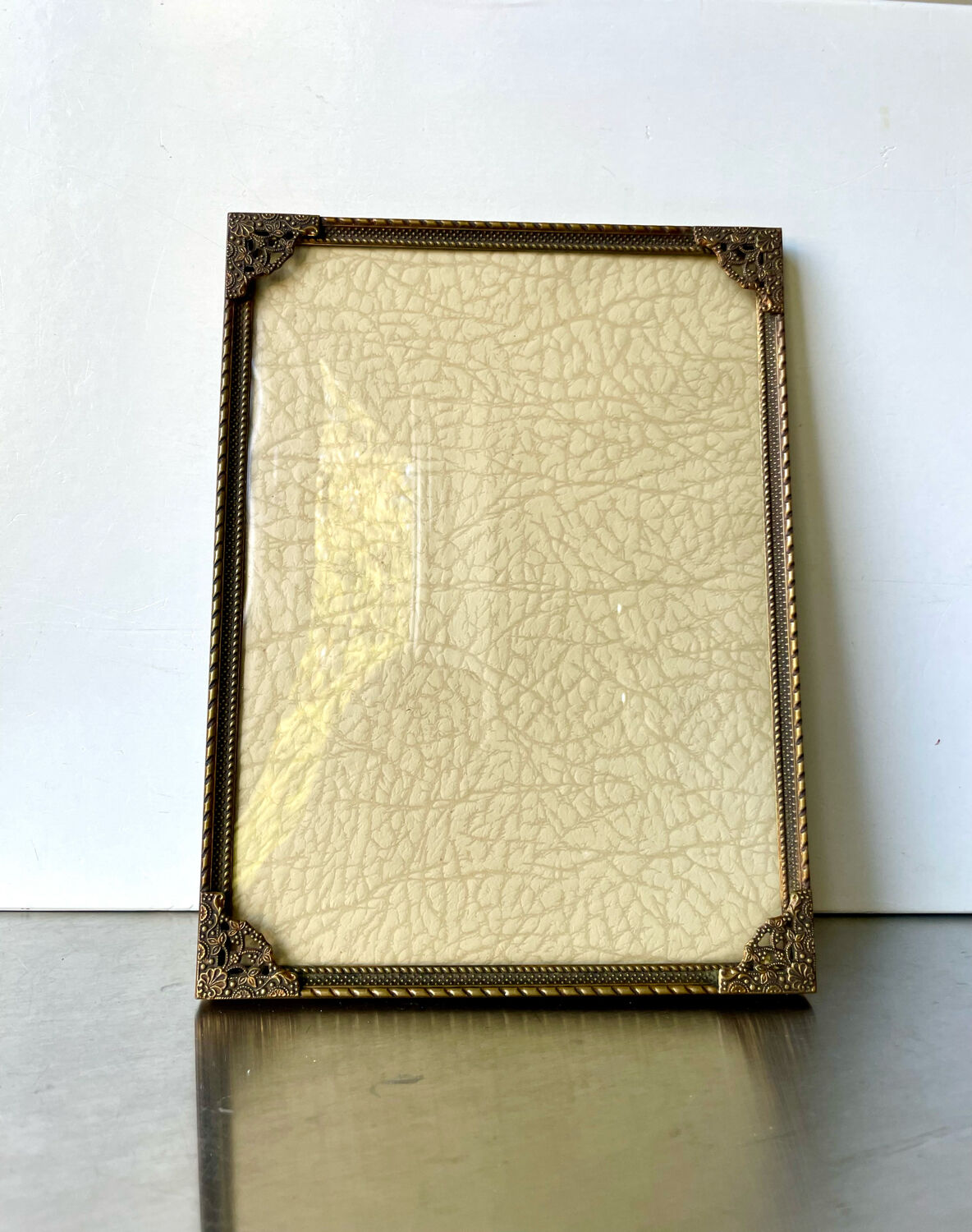 Metal frame in gold colored brass