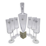 Carafe and 6 stemmed glasses made of Murano glass.