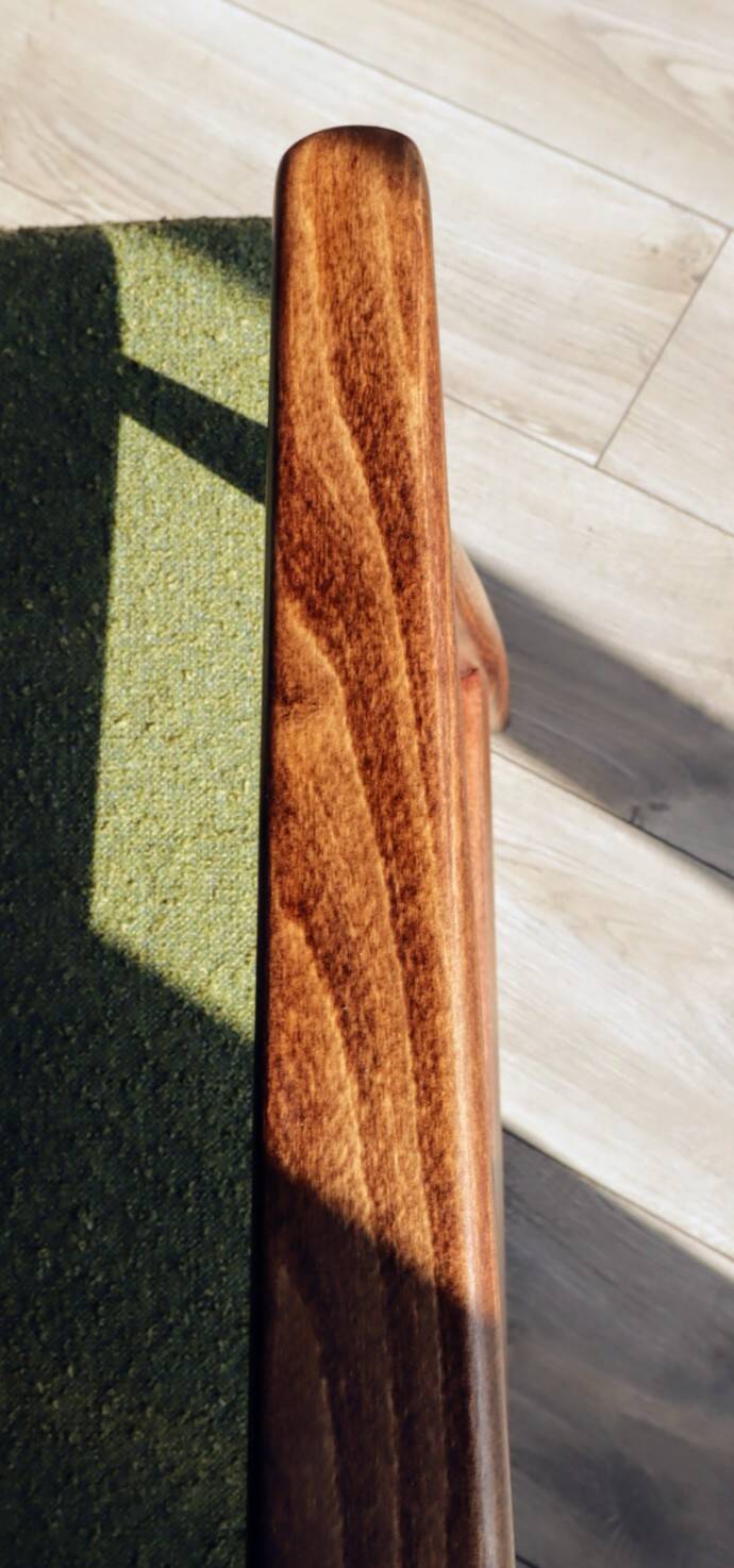 Mid-century modern armchair in olive green bouclé design by H. Lis.