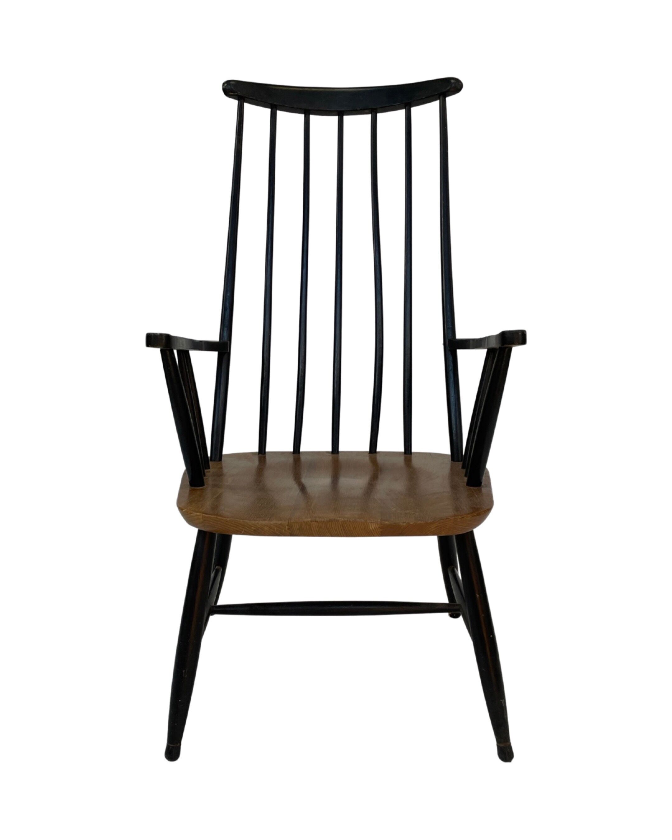 Vintage easy chair with high back and armrest from the 60s