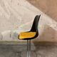 Set of black and yellow tulip chairs