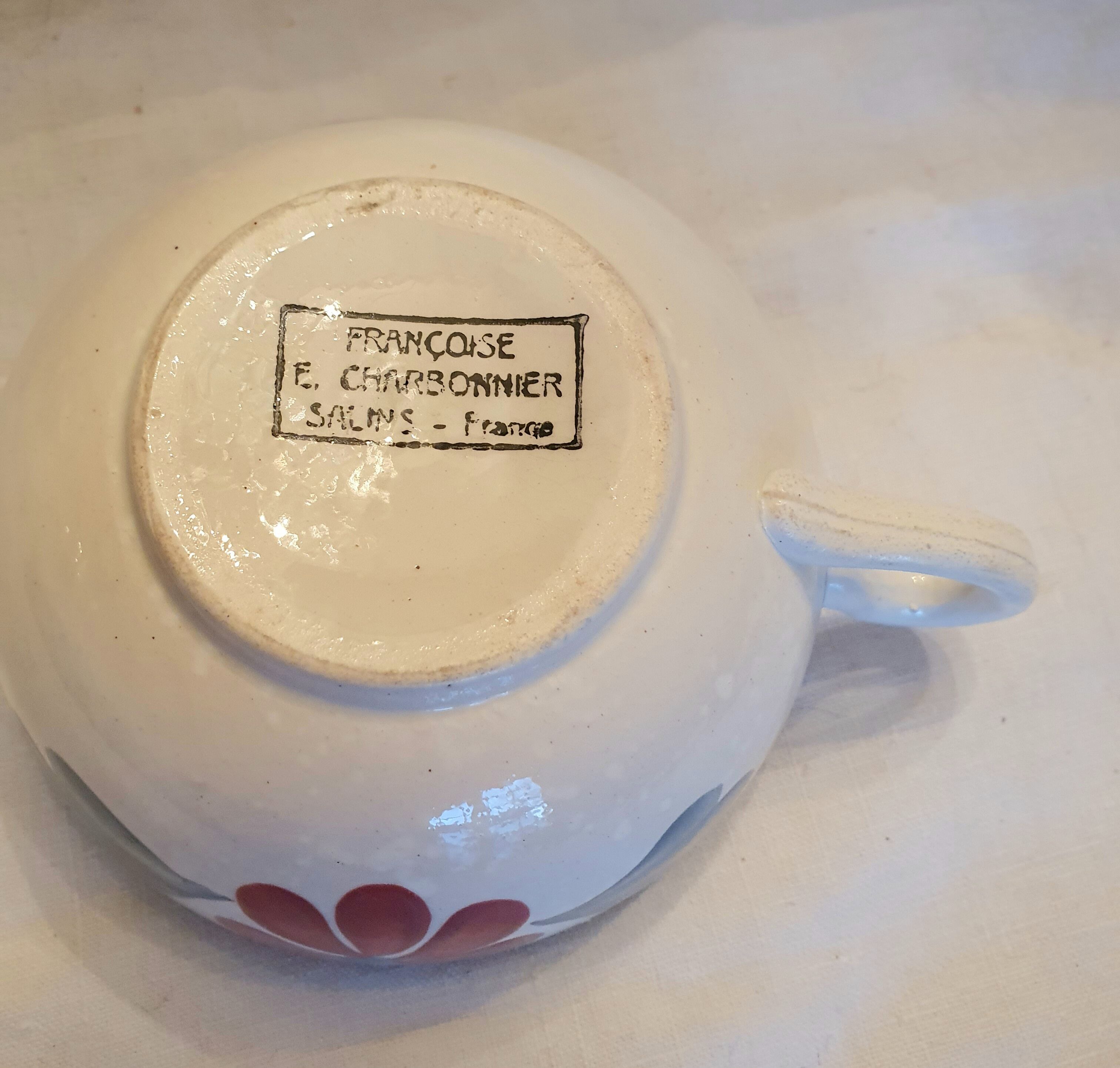Old big cup in faience with flower decoration