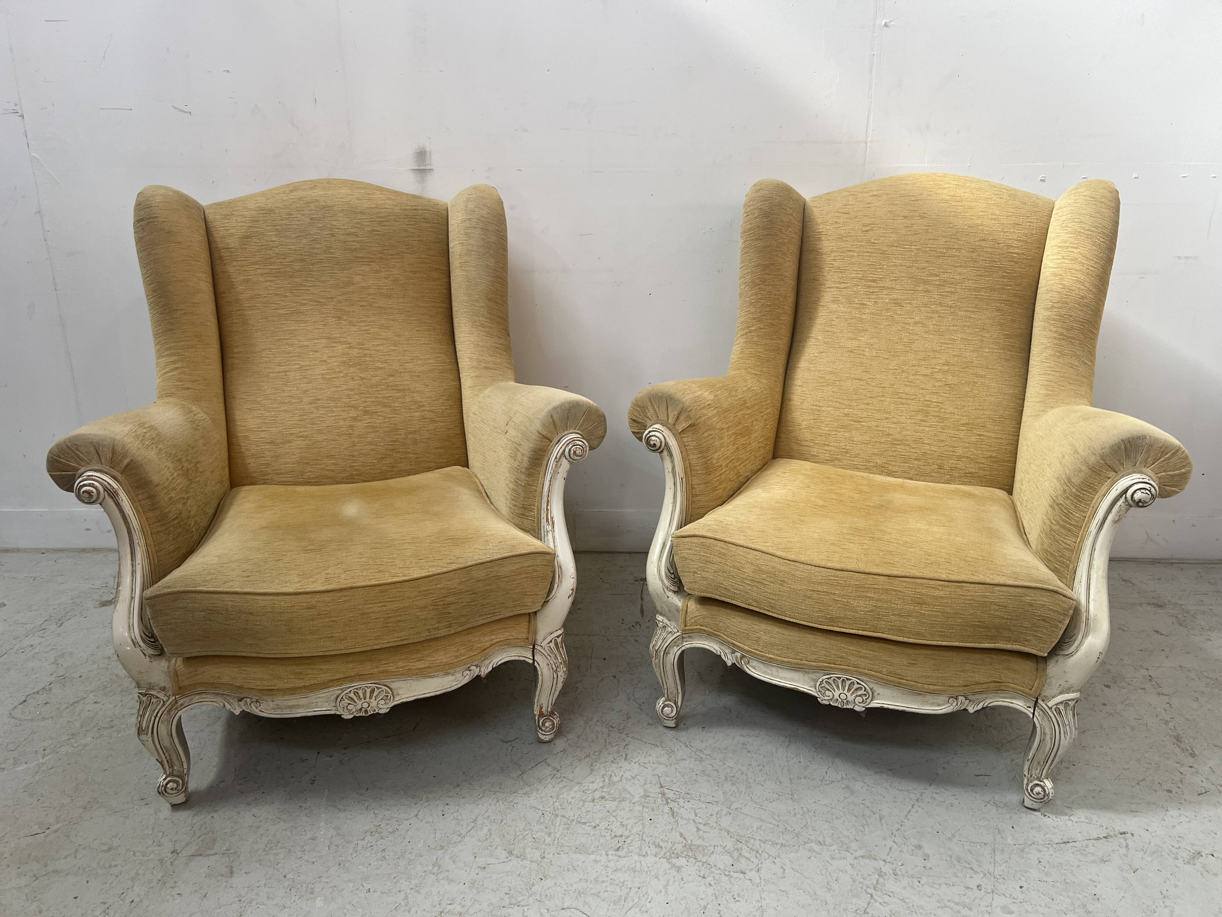 Pair of Louis XV style wing chairs in patinated beech, 20th century