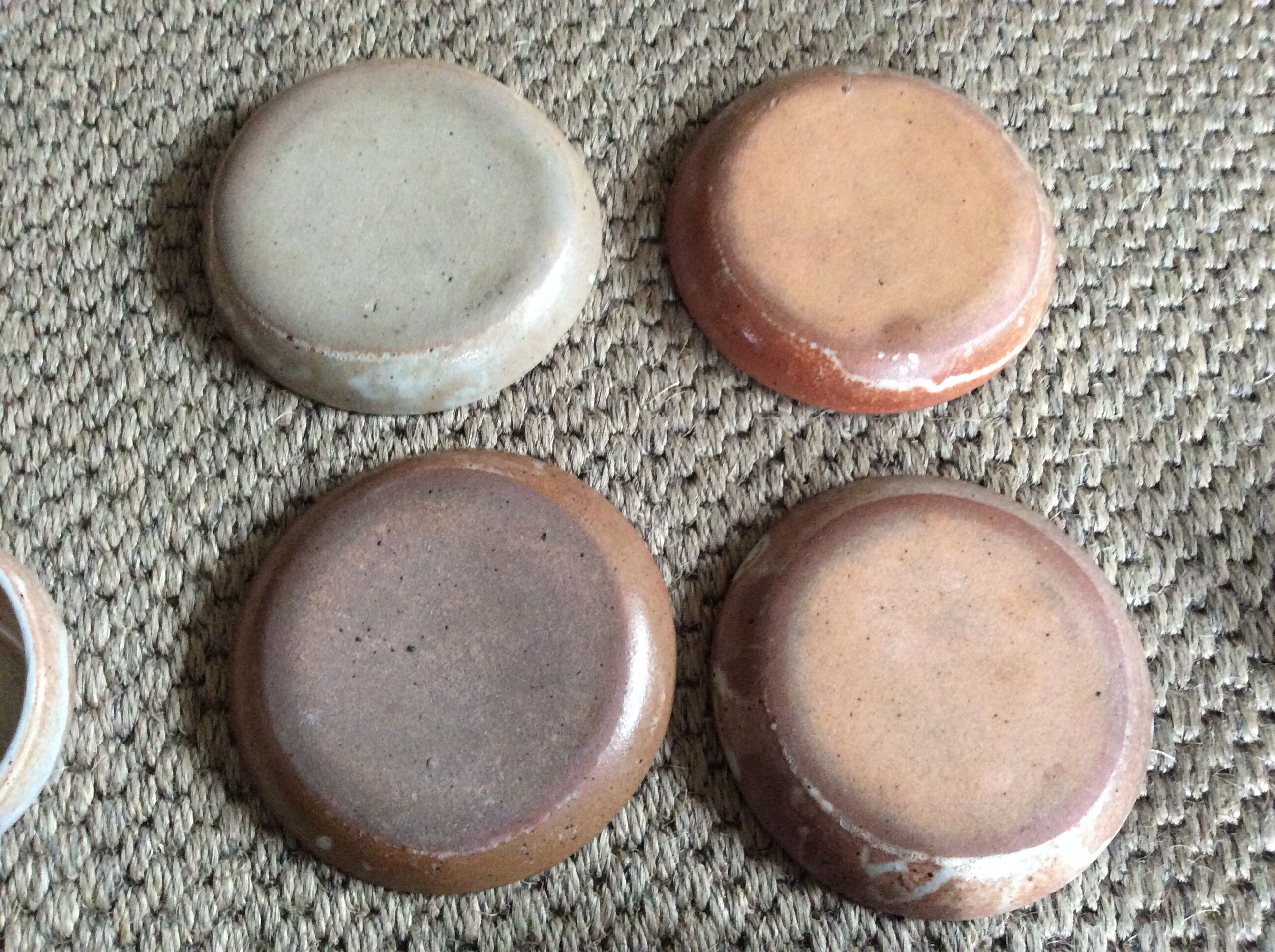 Series of 4 stoneware coffee cups