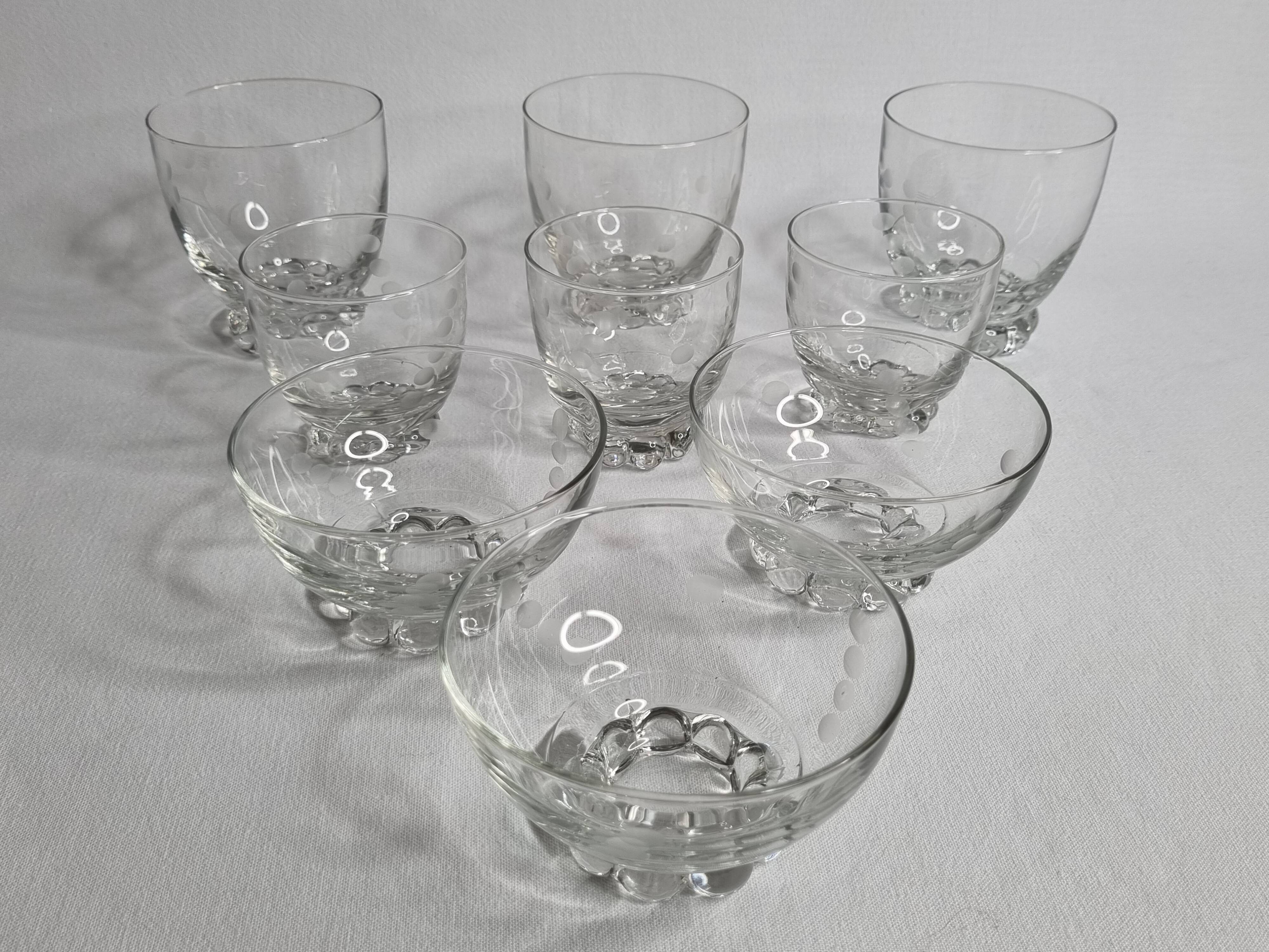 Set of Art Deco style engraved crystal bowls and glasses on spherical feet
