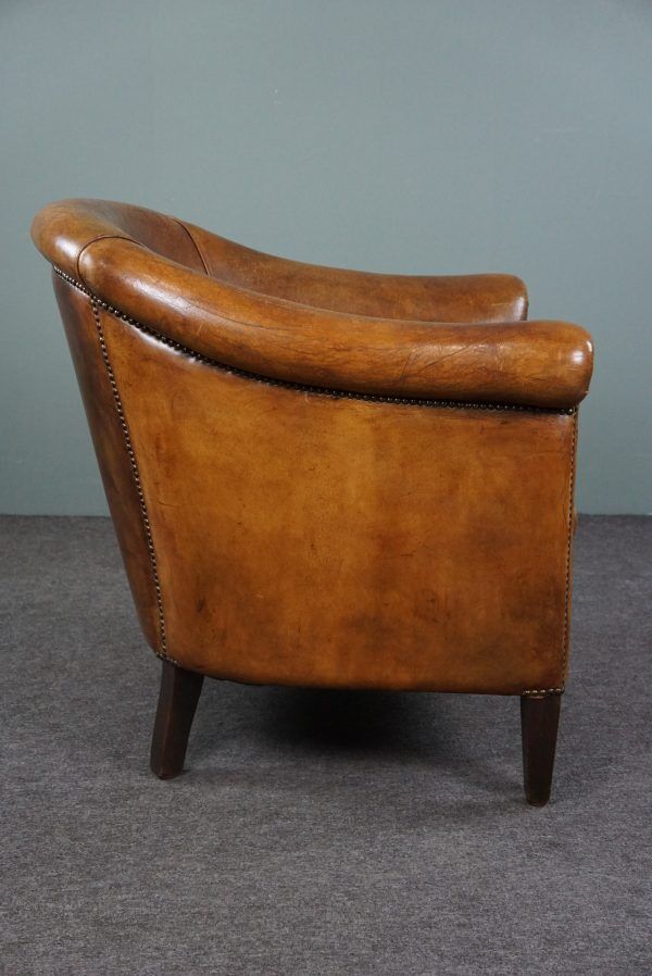 Club chair in patinated sheepskin
