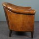 Club chair in patinated sheepskin