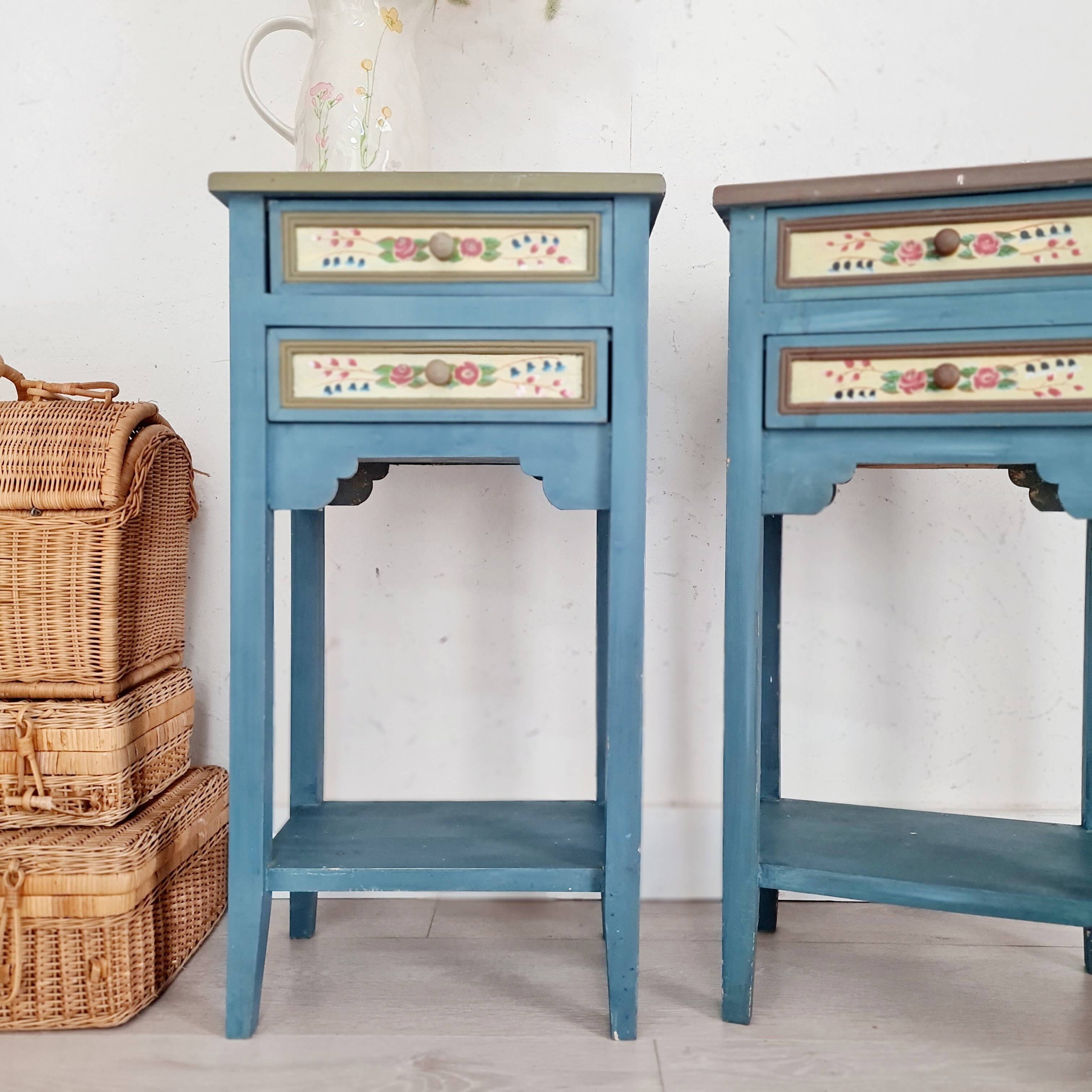 Blue wooden bedside tables with floral patterns