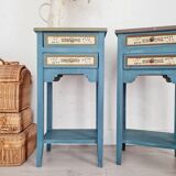 Blue wooden bedside tables with floral patterns