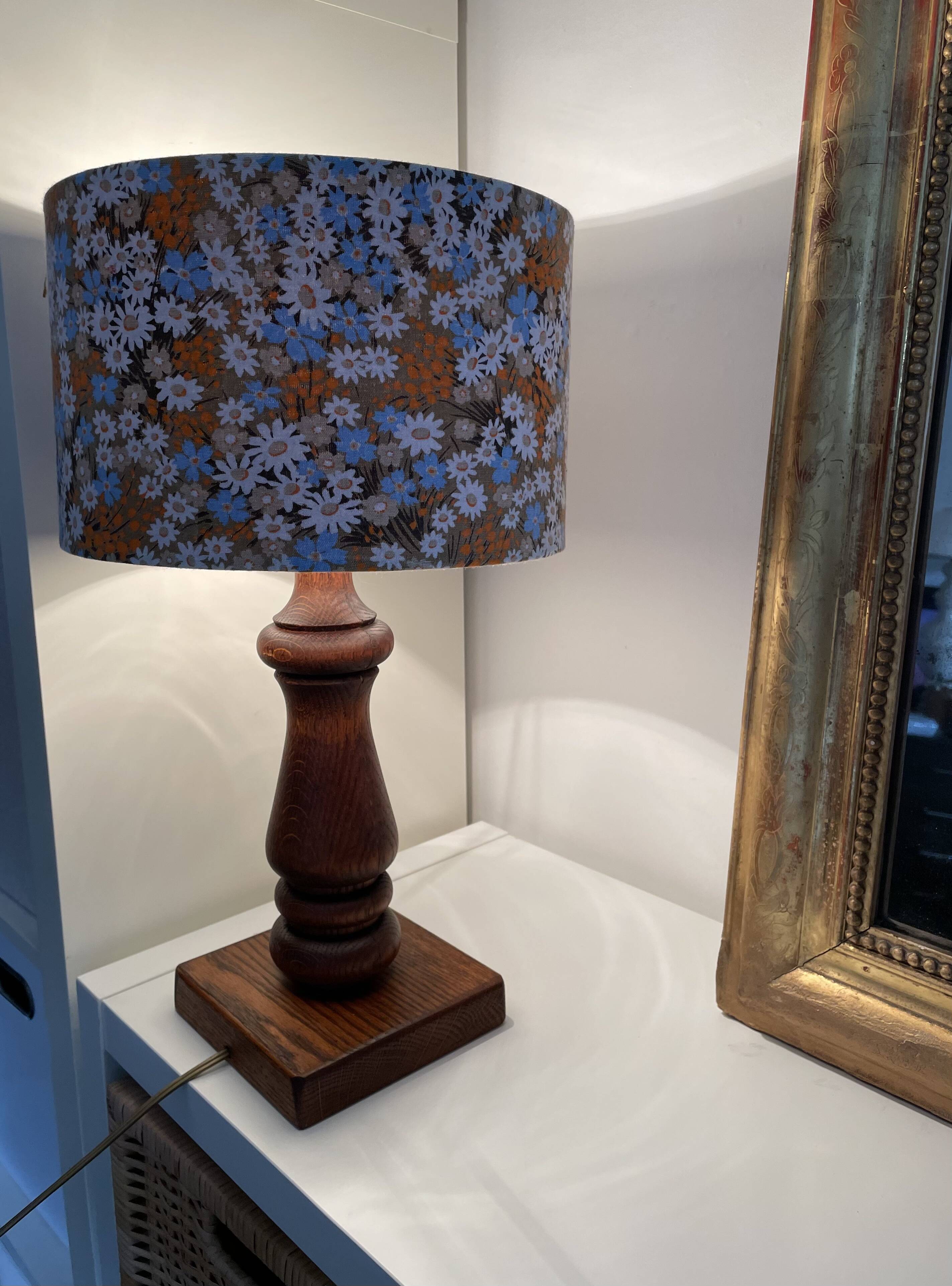 Vintage turned wood table lamp with floral drum shade.