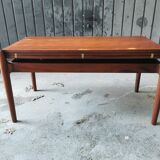 Vintage coffee table with Scandinavian rise and fall system in teak