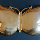 Empty brass butterfly pocket