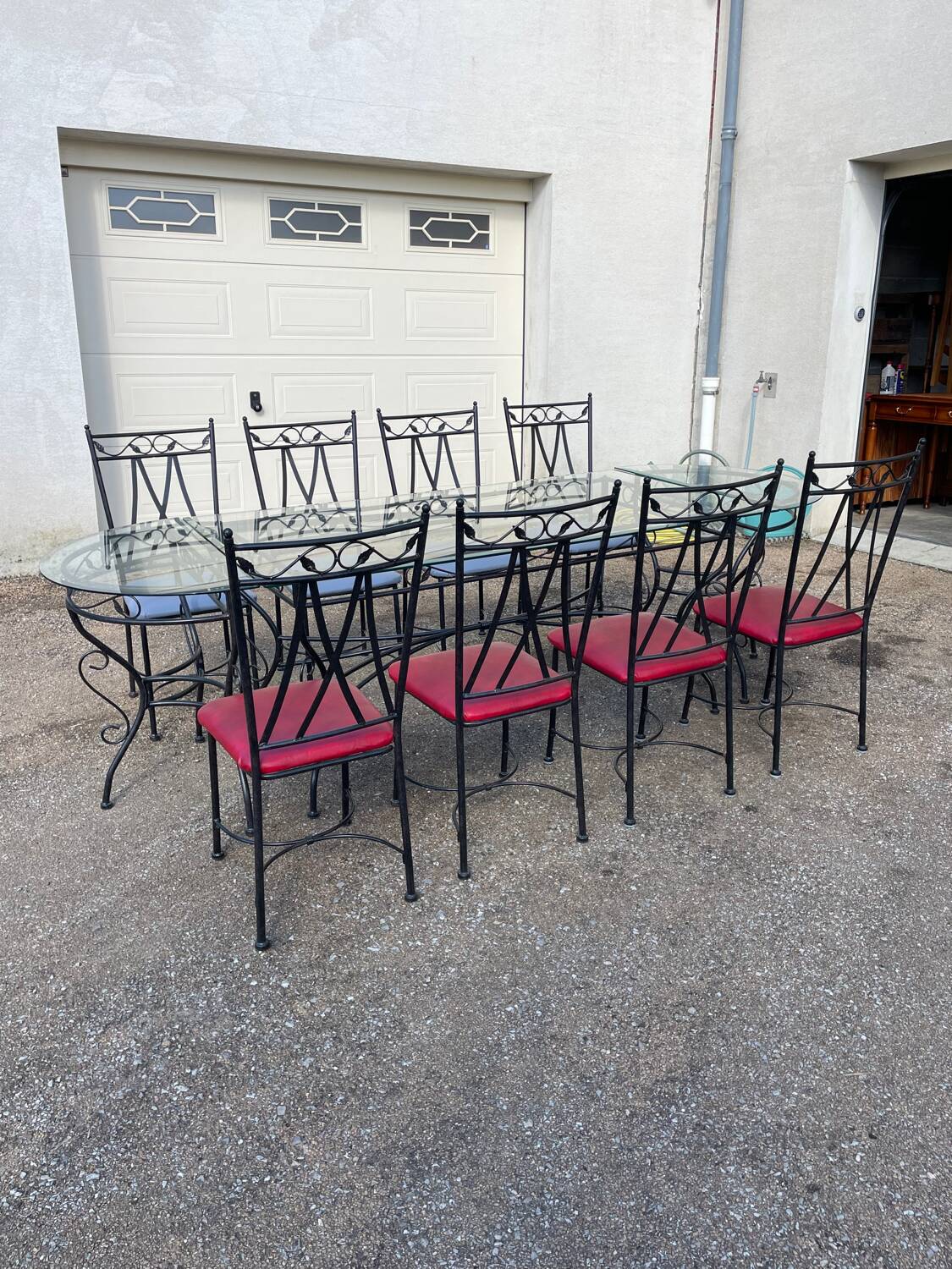Glass and iron table with two side tables and 8 chairs