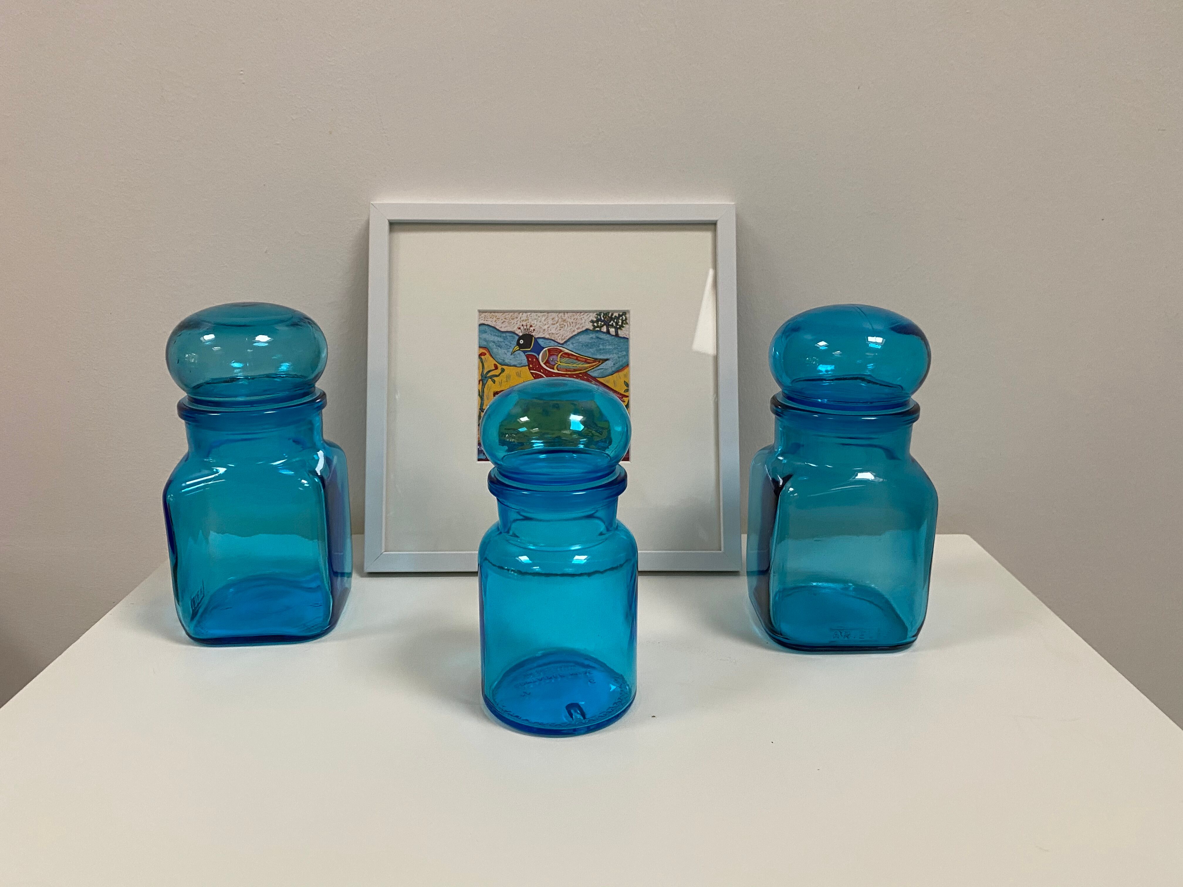 Trio of vintage turquoise blue glass jars