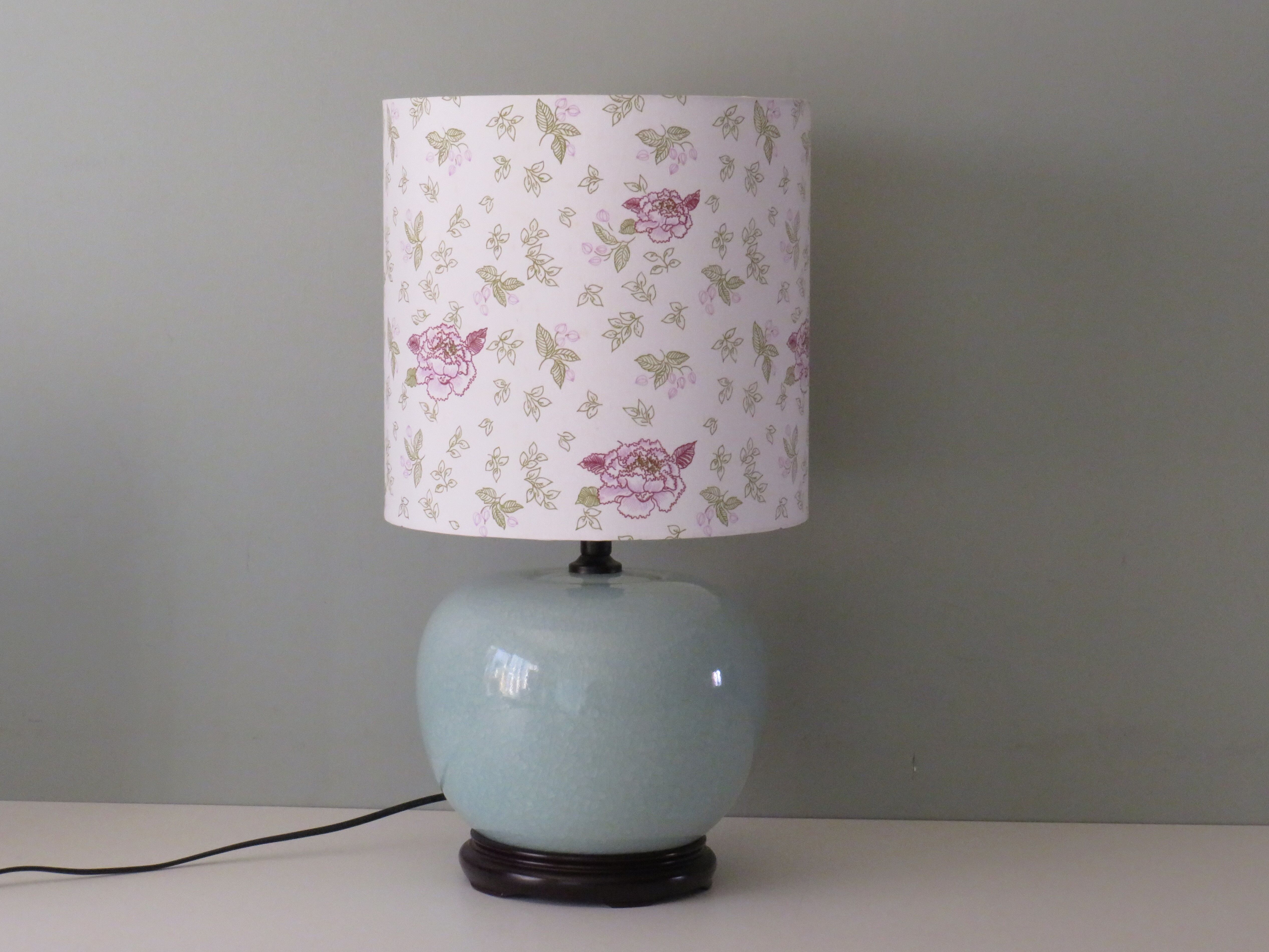 Celadon-colored cracked ceramic table lamp with new personalized lampshade.