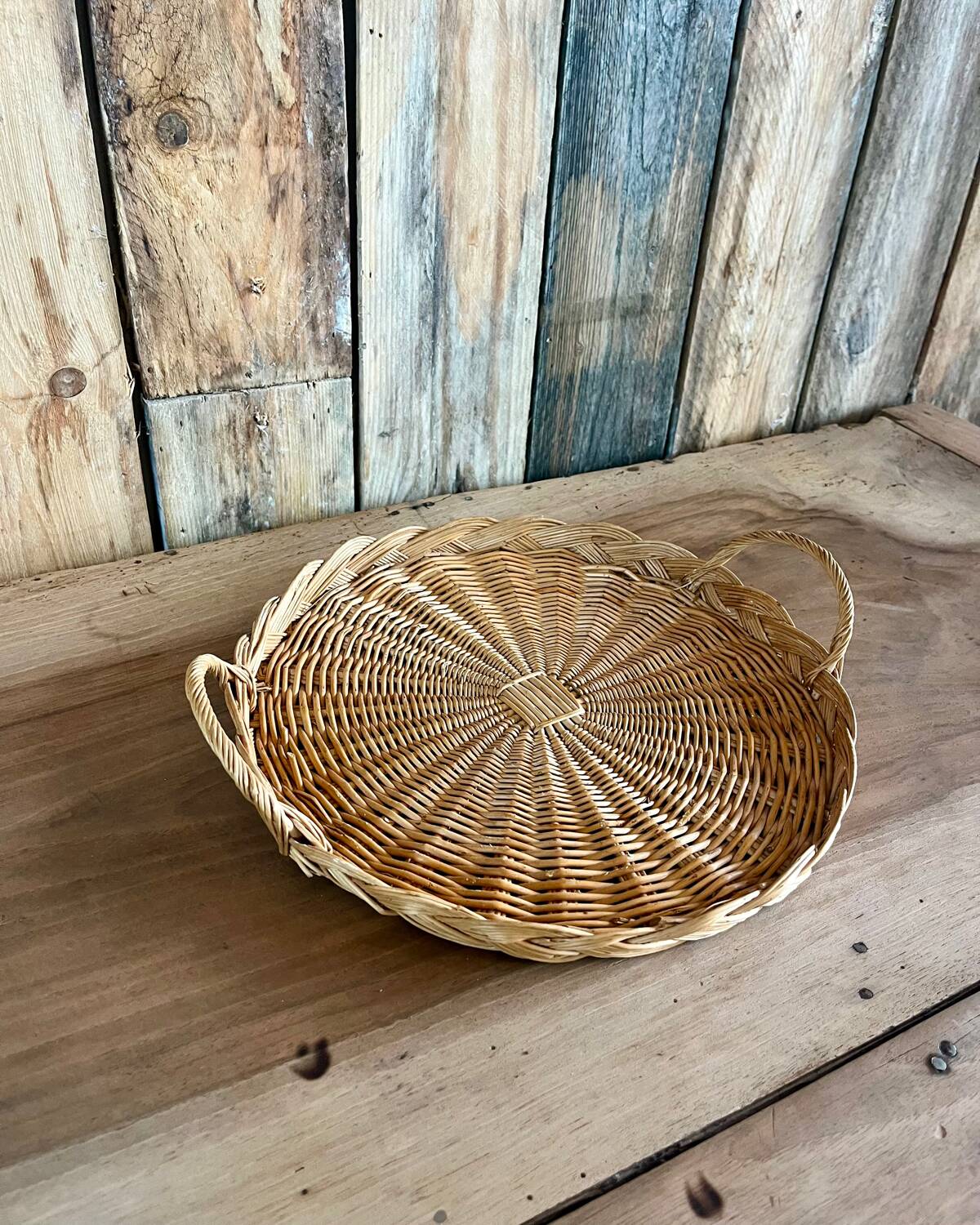 Antique flat round rattan basket
