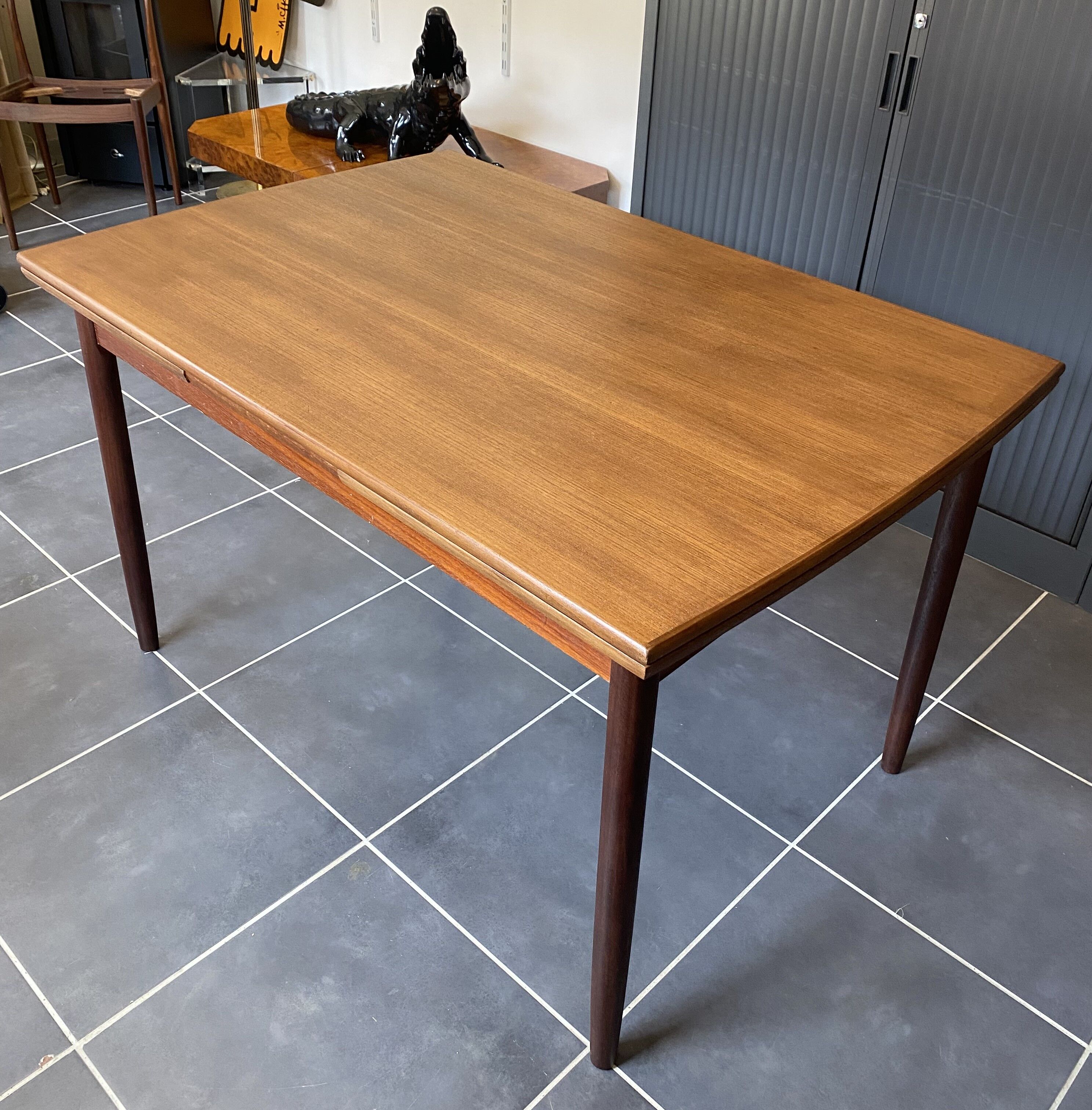 Extendable Scandinavian teak table by Johannes Andersen for Samcom Denmark.