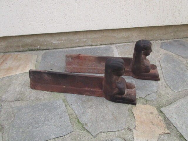 Pair of ancient cast iron chenets, Egyptian busts