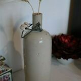 Sandstone bottle and porcelain cap