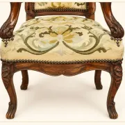Louis XV cabriolet armchair, carved walnut, petit point tapestry, 18th century.
