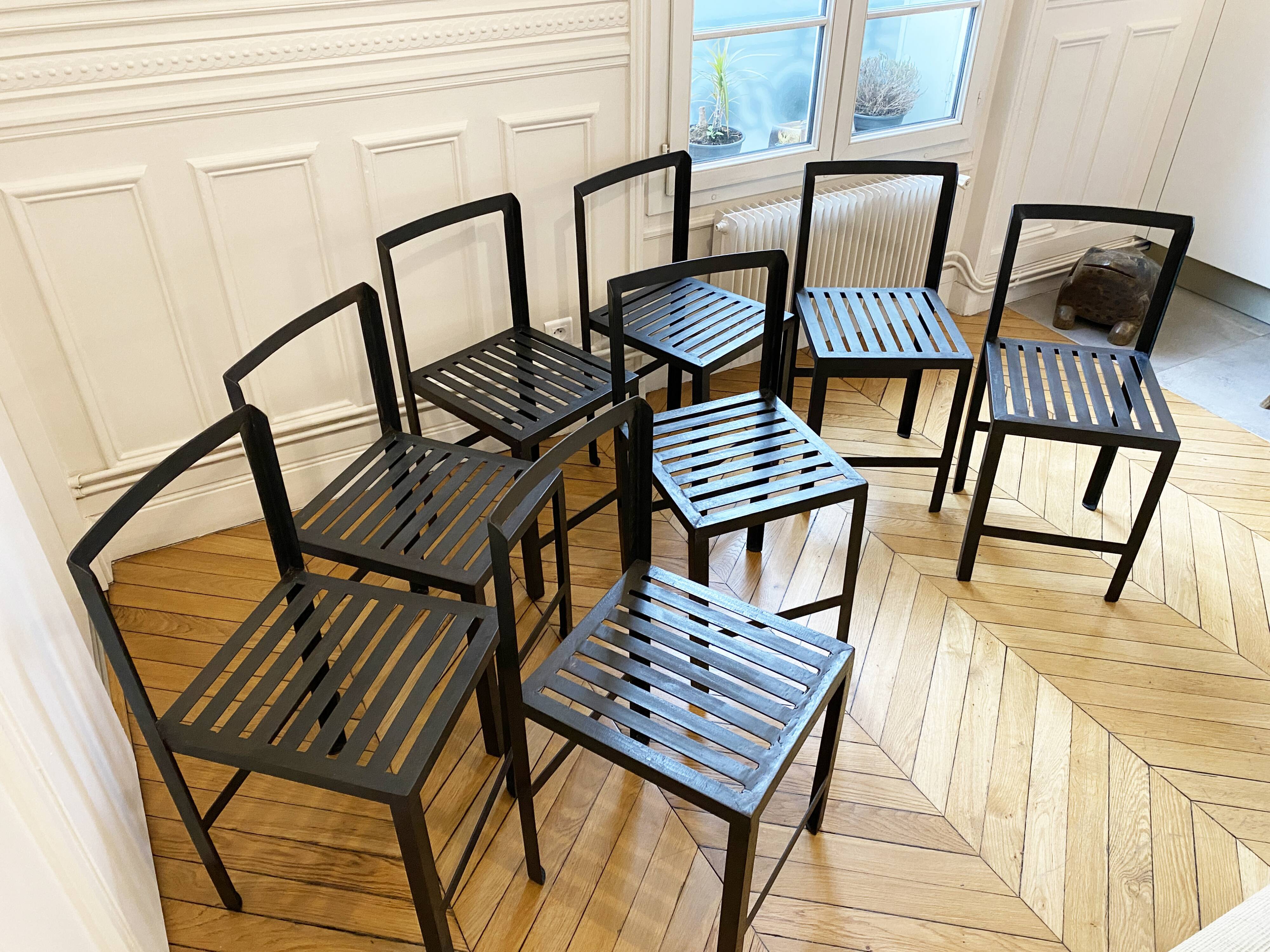 Set of 8 patinated and waxed raw steel chairs