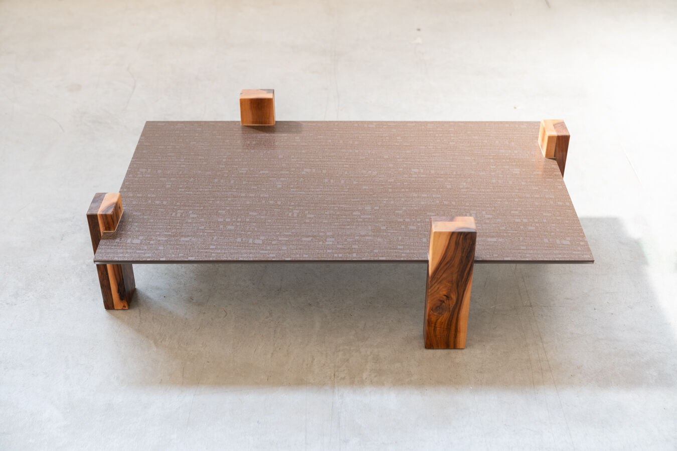 Handcrafted coffee table with ceramic glass top and walnut legs