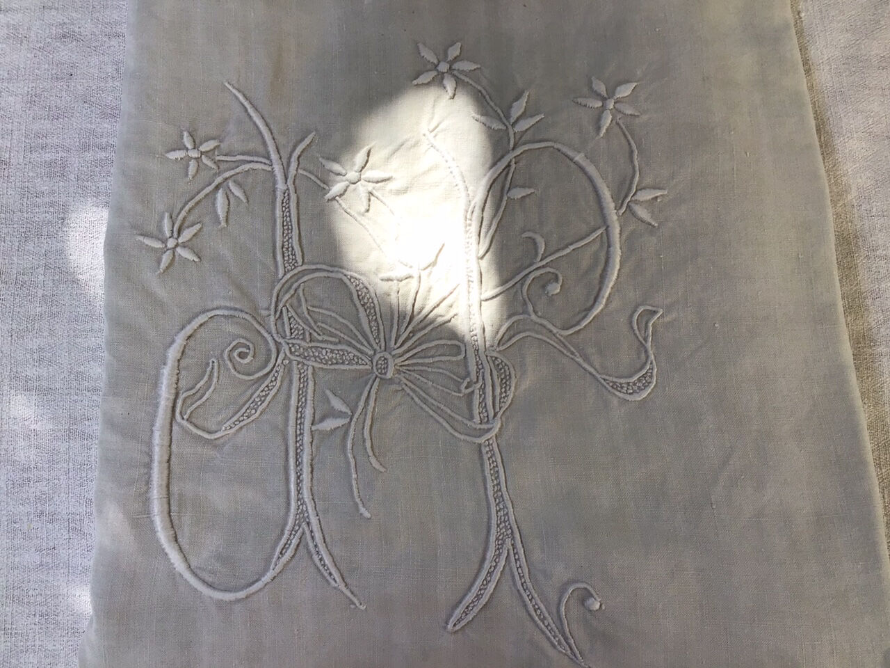 Embroidered linen sheet marked "JP"