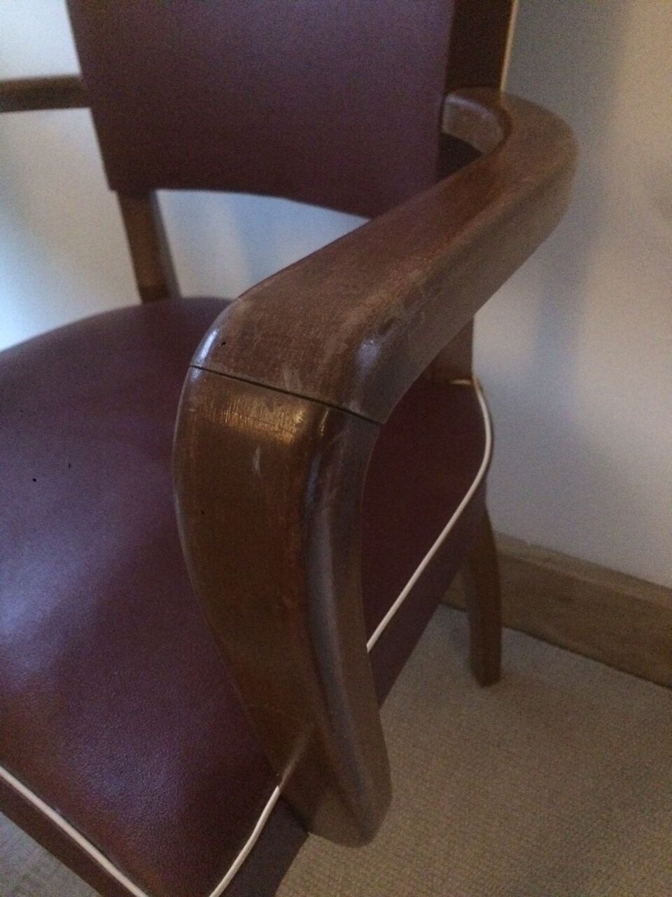 Skai chair binds wine and wooden footpieces and armrests