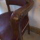 Skai chair binds wine and wooden footpieces and armrests