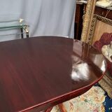 Empire style dining table with two sliding elements.