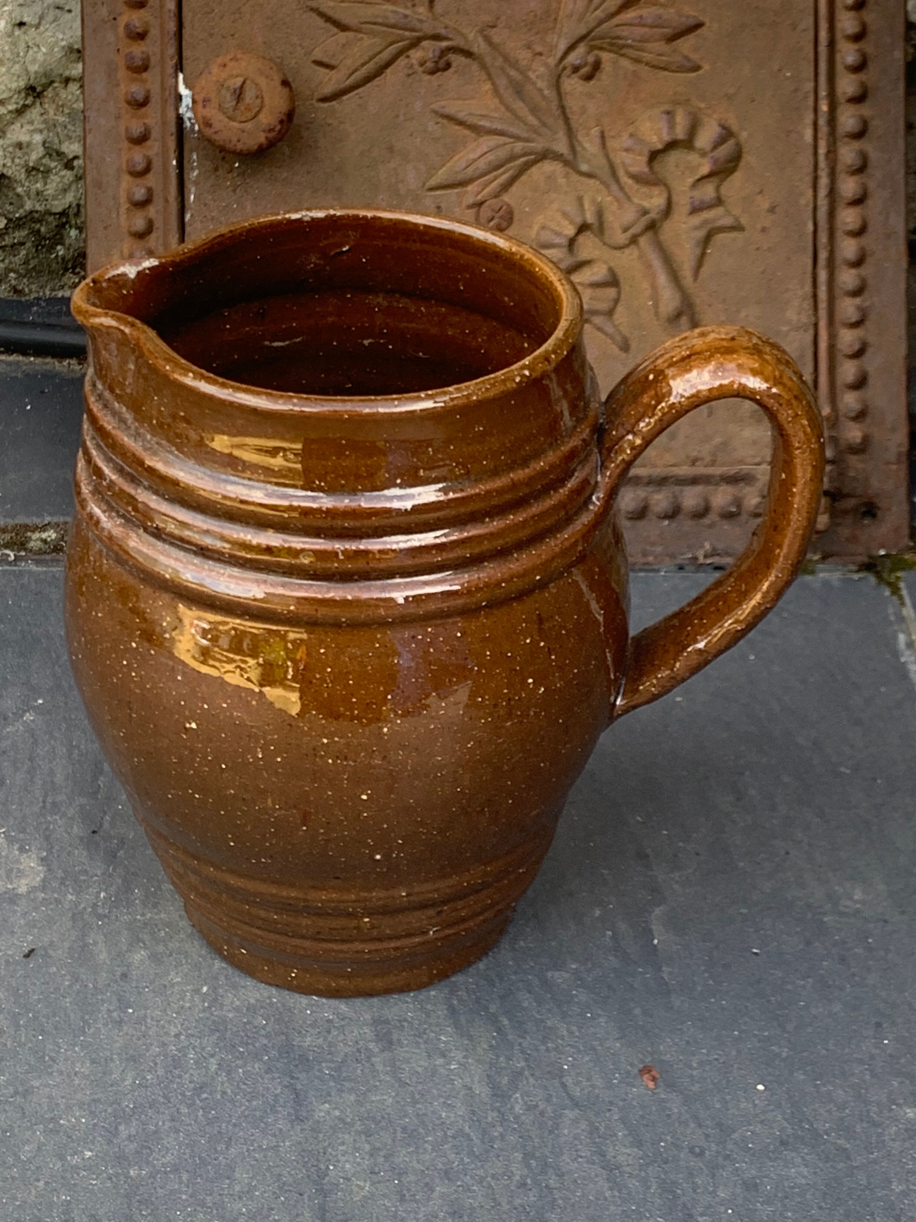 Pitcher old cider jug in glazed sandstone