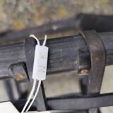 5 blackened wooden stools with woven leather seats by Nina Kaufmann