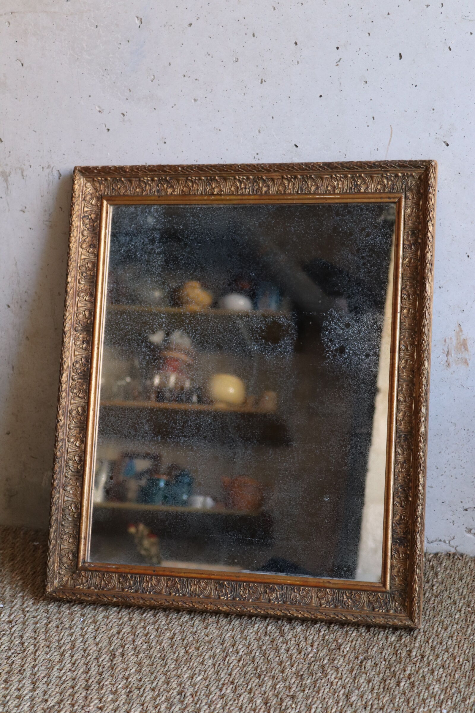 Antique mirror in wood and stucco