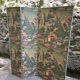 Wooden screen in Asian style, covered with Chinese wallpaper.