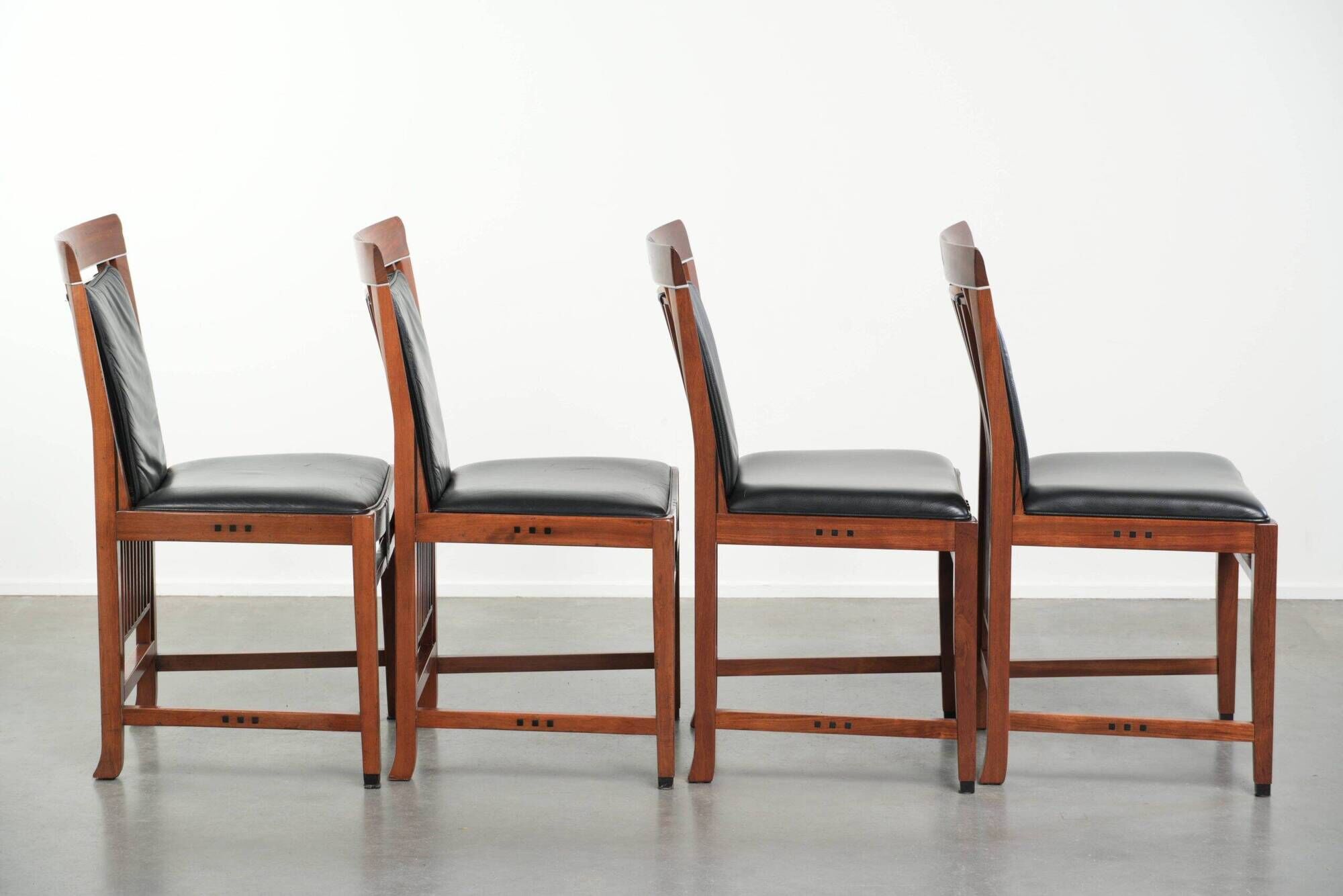 Elegant set of four black cowhide and wooden Art Deco dining chairs
