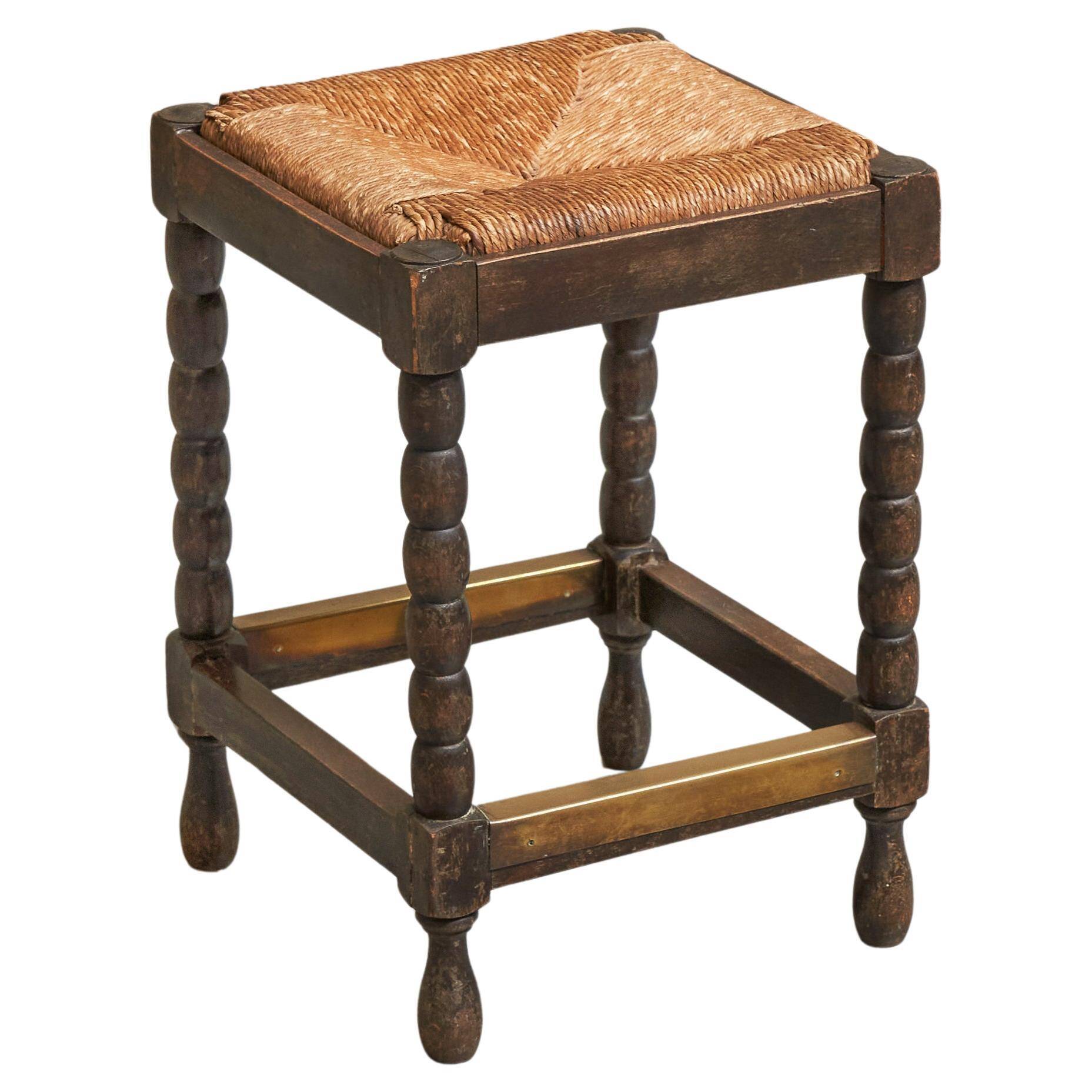 Solid oak stool, straw and brass from the 1920s.