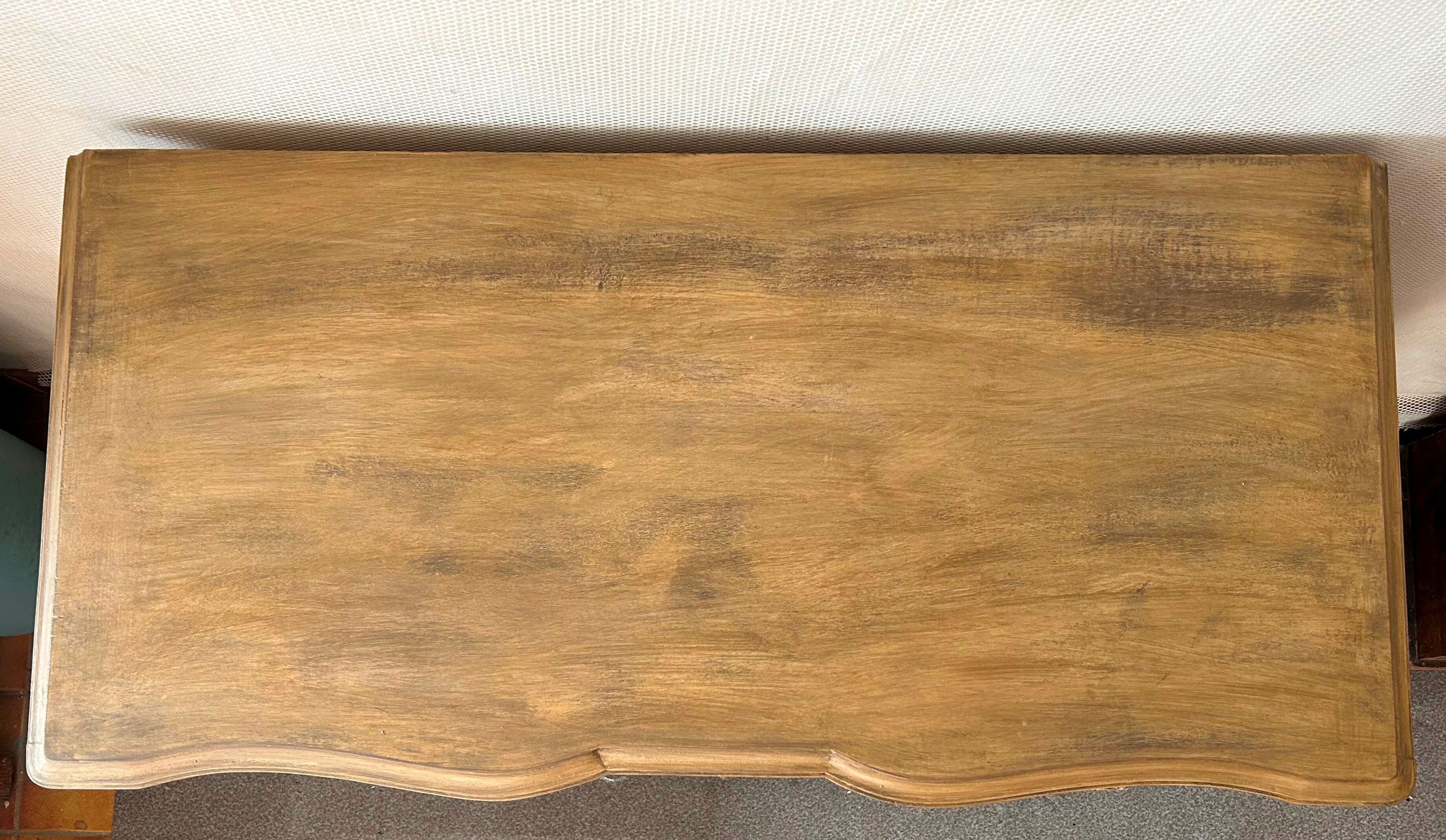 Patinated baroque crossbow chest of drawers