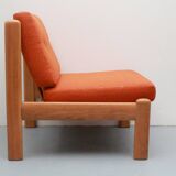 1970s chair in oak and orange cushions