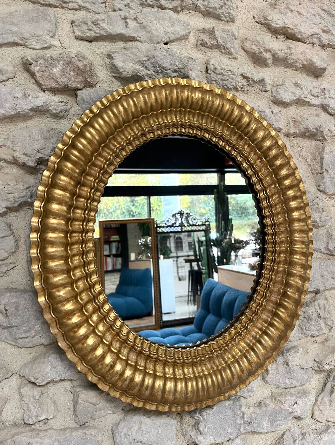 Pair of antique oval mirrors gilded with gold leaf and mercury.