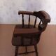 Armchair with wooden armrests