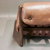 Leather armchair and oak, design 1950s