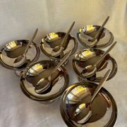 Set of 6 stainless steel ice cream bowls by Guy Degrenne with matching spoons.