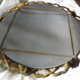 Bronze mirror gilded with roses, 72 cm