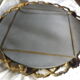 Bronze mirror gilded with roses, 72 cm