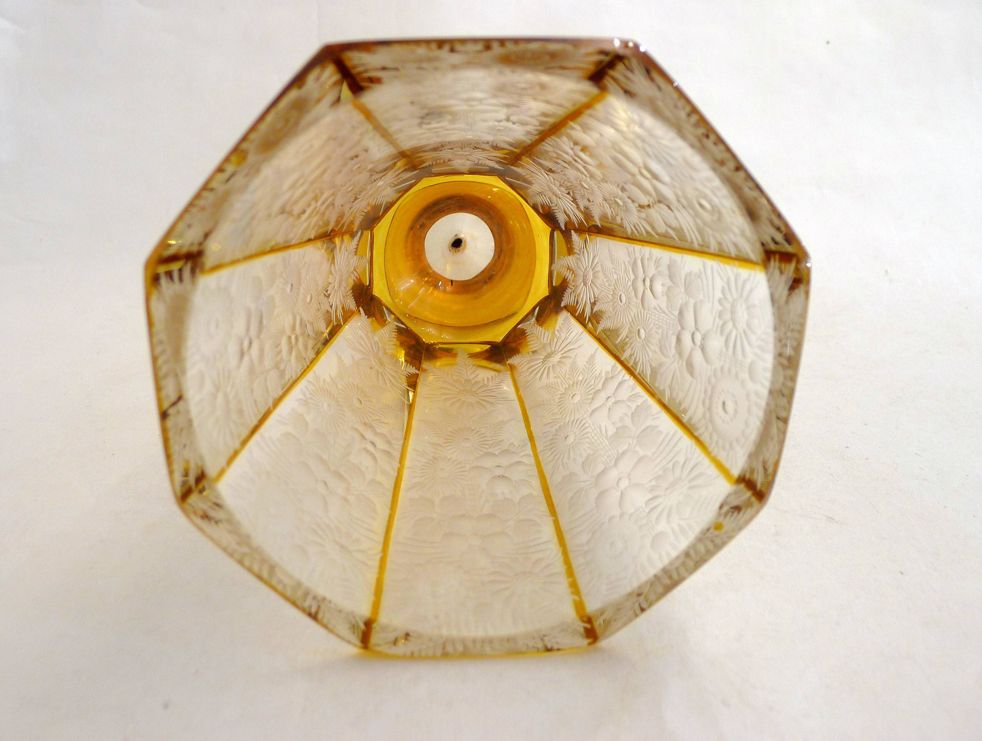 Art Deco vase engraved with flowers, faceted body on a pedestal.