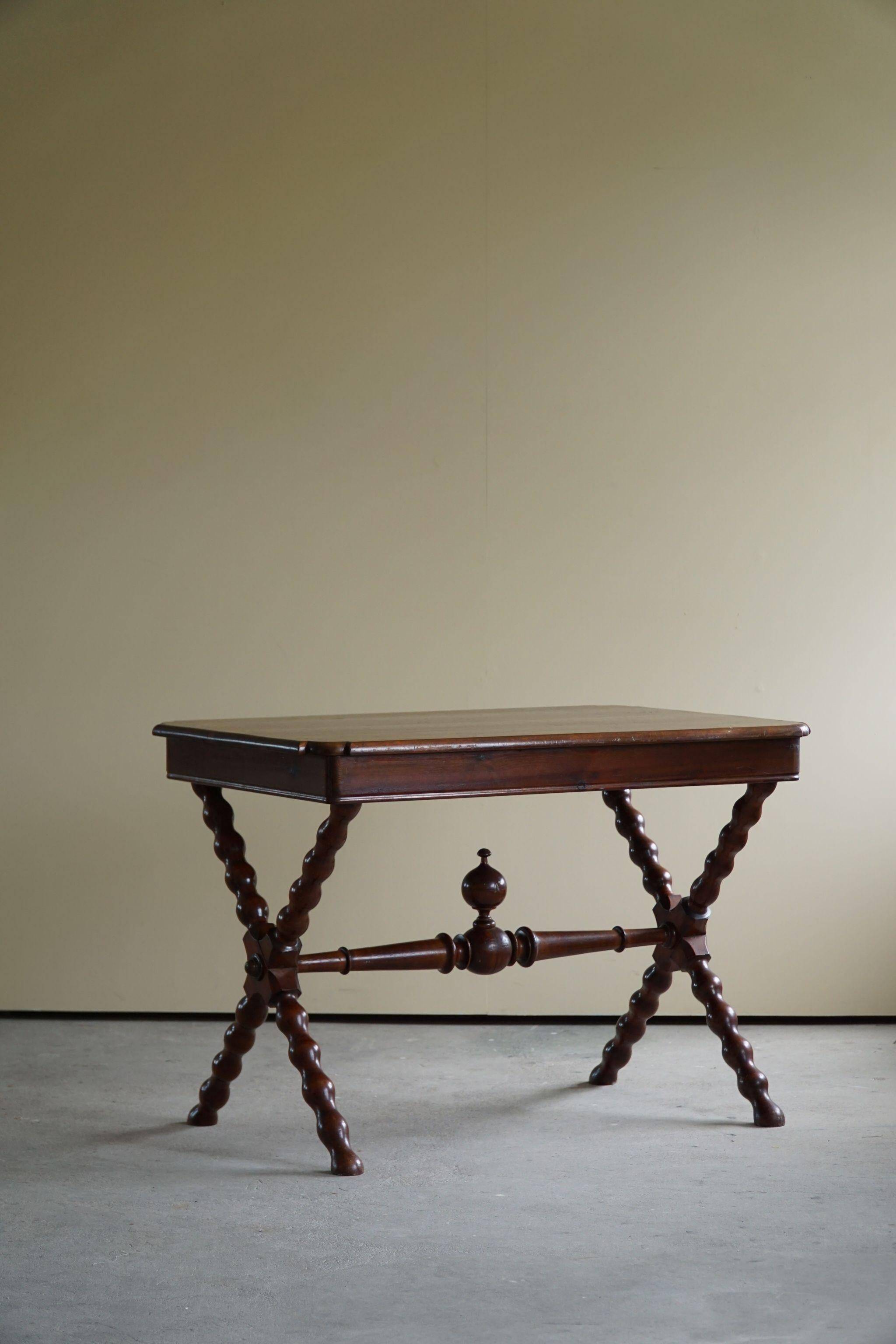 French sculptural desk in stained pine, early 20th century, Baroque style.