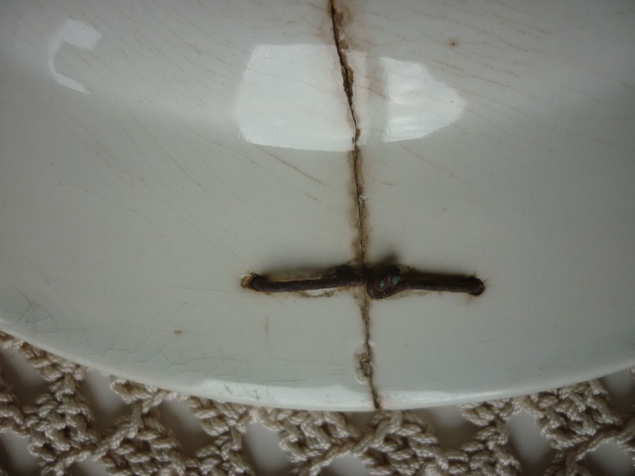 Old repaired plate stapled