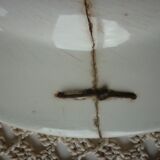 Old repaired plate stapled